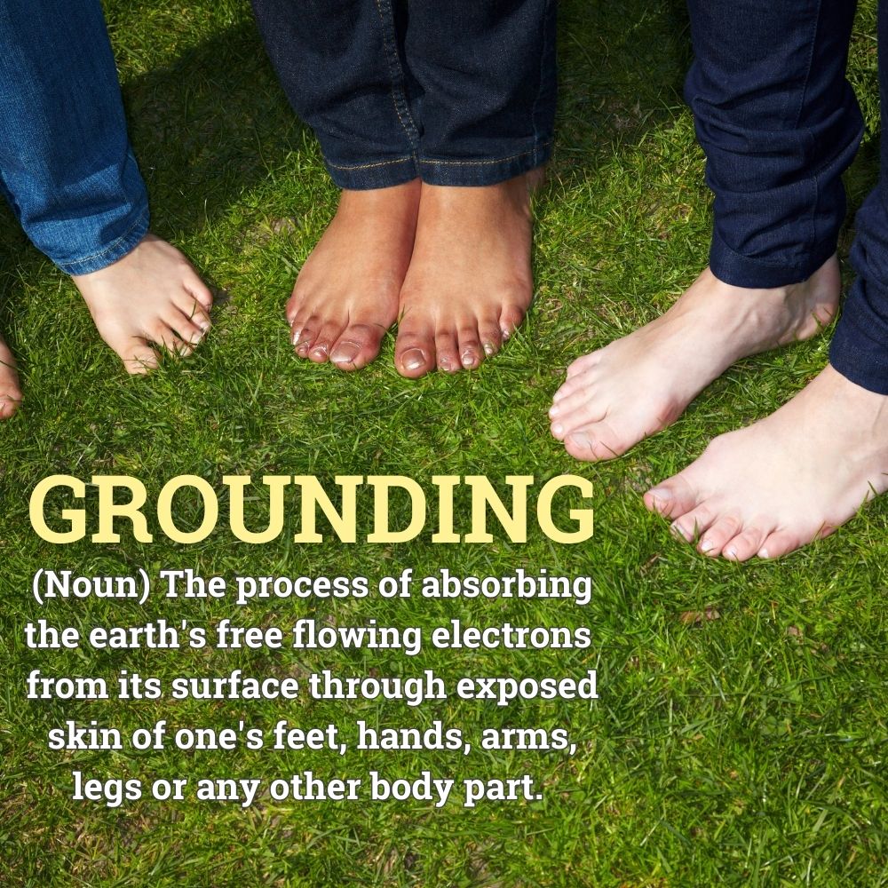 barefoot people on grass with overlayed definition of grounding in terms of earth and electrons
