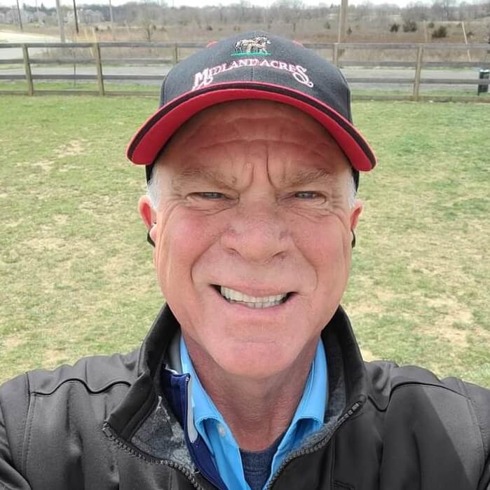 Man with cap smiling