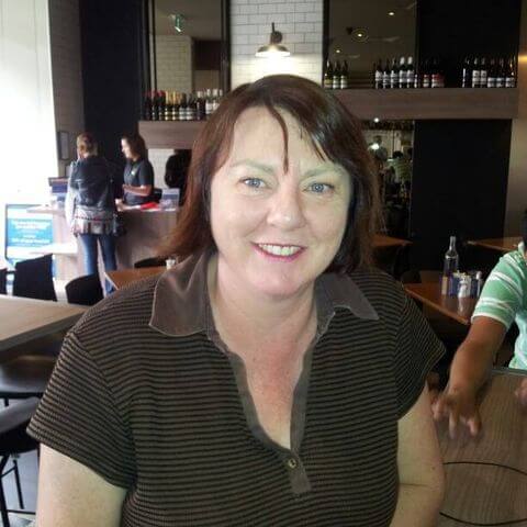 Woman smiling in a cafe